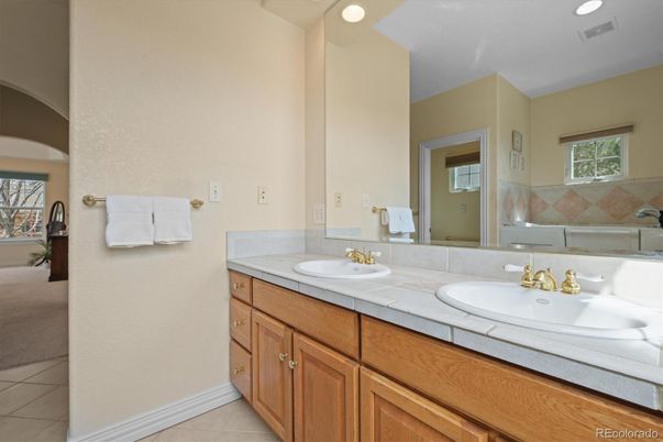 Bathroom, Dual Sink Vanities, Interior, Recessed Lighting, Tile Countertops