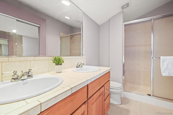 Bathroom, Dual Sink Vanities, Glass Shower, Interior, Recessed Lighting, Tile Countertops