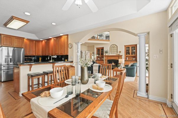 Dining room, Fireplace, Interior, Kitchen, Living room, Recessed Lighting, Stainless Steel Appliances, Wood Texture Flooring