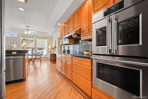 Dining room, Interior, Kitchen, Recessed Lighting, Stainless Steel Appliances, Wood Texture Flooring