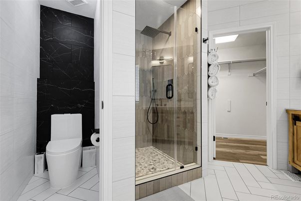Bathroom, Glass Shower, Interior, Marble Walls, Wood Texture Flooring