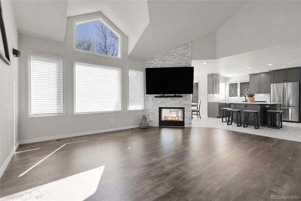 Dining room, Fireplace, Interior, Kitchen, Recessed Lighting, Stainless Steel Appliances, Wood Texture Flooring