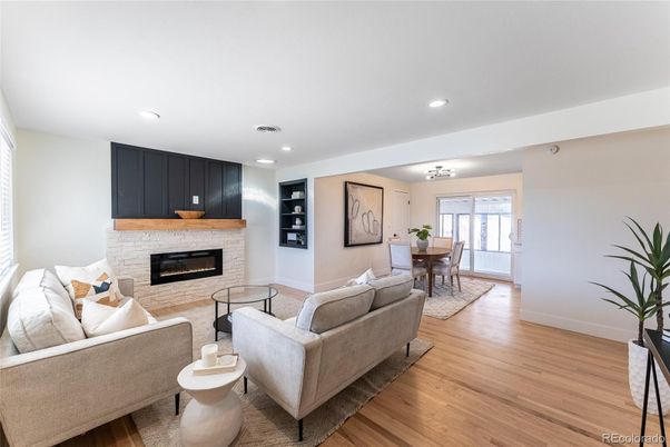 Dining room, Fireplace, Interior, Living room, Recessed Lighting, Wood Texture Flooring