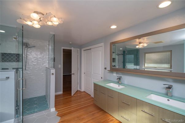 Bathroom, Dual Sink Vanities, Glass Shower, Interior, Recessed Lighting, Wood Texture Flooring