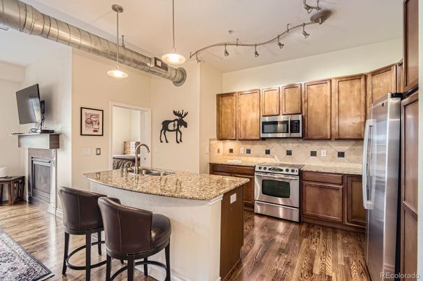 Fireplace, Interior, Kitchen, Pendant Lights, Stainless Steel Appliances, Wood Texture Flooring