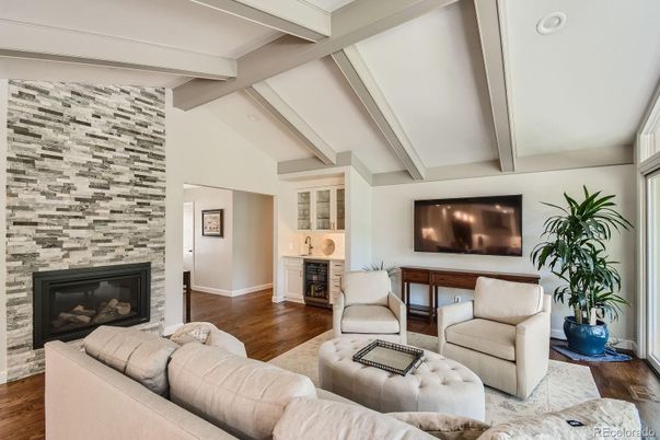 Fireplace, Interior, Living room, Recessed Lighting, Stone Walls, Wood Texture Flooring