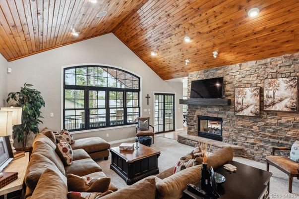 Fireplace, Interior, Living room, Recessed Lighting, Stone Walls, Wooden Ceilings