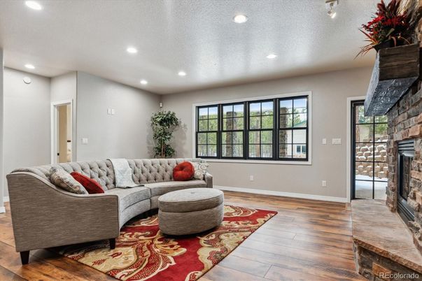 Fireplace, Interior, Living room, Recessed Lighting, Wood Texture Flooring