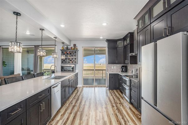Fireplace, Interior, Kitchen, Pendant Lights, Recessed Lighting, Stainless Steel Appliances, Wood Texture Flooring