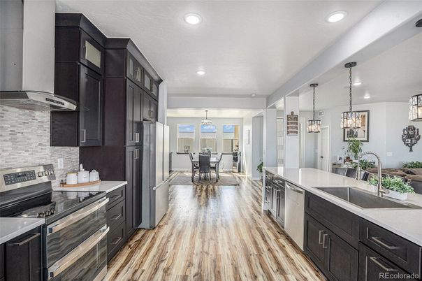 Dining room, Interior, Kitchen, Pendant Lights, Recessed Lighting, Stainless Steel Appliances, Wood Texture Flooring