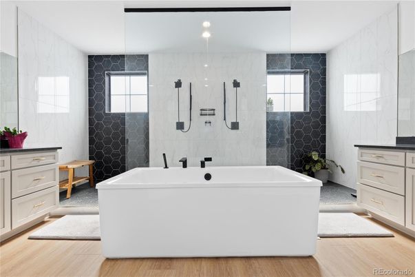 Bathroom, Dual Sink Vanities, Interior, Marble Walls, Recessed Lighting, Wood Texture Flooring