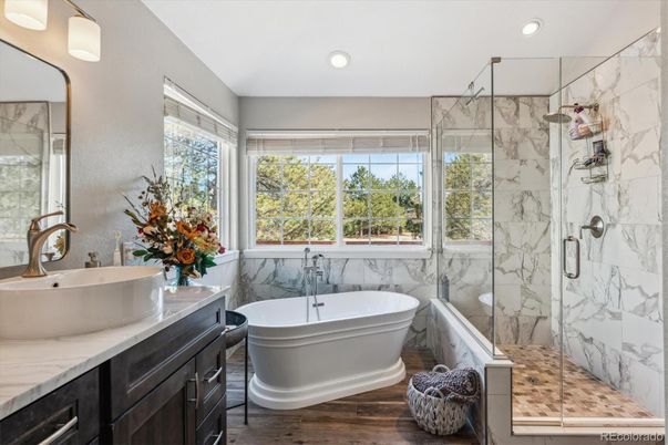 Bathroom, Free Standing Baths, Glass Shower, Interior, Marble Walls, Recessed Lighting, Wood Texture Flooring