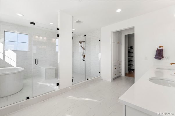 Bathroom, Dual Sink Vanities, Free Standing Baths, Glass Shower, Interior, Marble, Marble Walls, Recessed Lighting