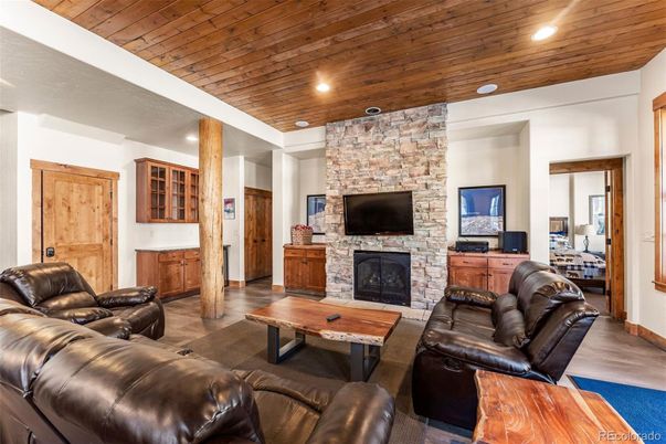 Fireplace, Interior, Living room, Recessed Lighting, Stone Walls, Wooden Ceilings, Wood Texture Flooring
