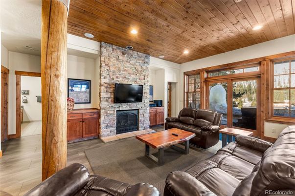 Fireplace, Interior, Living room, Recessed Lighting, Stone Walls, Wooden Ceilings, Wood Texture Flooring