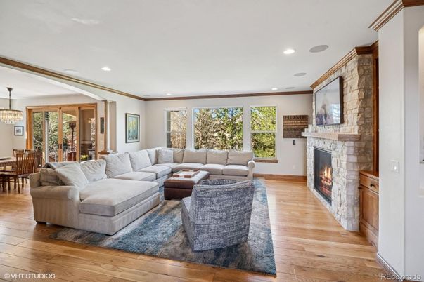 Chandelier, Dining room, Fireplace, Interior, Living room, Pendant Lights, Recessed Lighting, Wood Texture Flooring