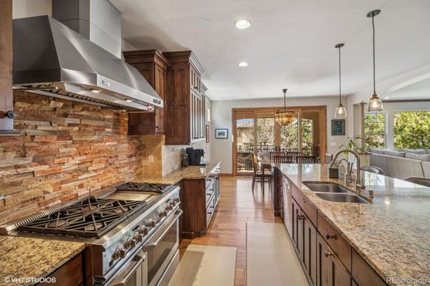 Chandelier, Dining room, Interior, Kitchen, Pendant Lights, Recessed Lighting, Stainless Steel Appliances, Wood Texture Flooring