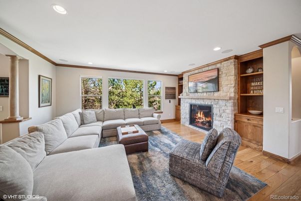 Fireplace, Interior, Living room, Recessed Lighting, Stone Walls, Wood Texture Flooring