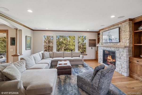 Fireplace, Interior, Living room, Recessed Lighting, Stone Walls, Wood Texture Flooring