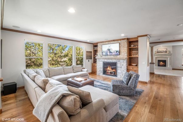 Fireplace, Interior, Living room, Recessed Lighting, Stone Walls, Wood Texture Flooring