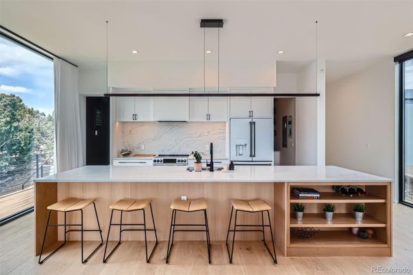 Interior, Kitchen, Marble Walls, Pendant Lights, Recessed Lighting, Stainless Steel Appliances, Wood Texture Flooring