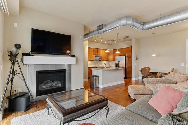 Fireplace, Interior, Kitchen, Living room, Pendant Lights, Stainless Steel Appliances, Wood Texture Flooring