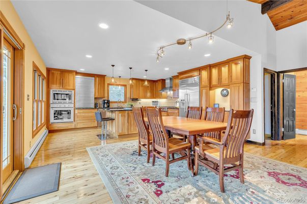 Dining room, Interior, Kitchen, Pendant Lights, Recessed Lighting, Stainless Steel Appliances, Wood Texture Flooring
