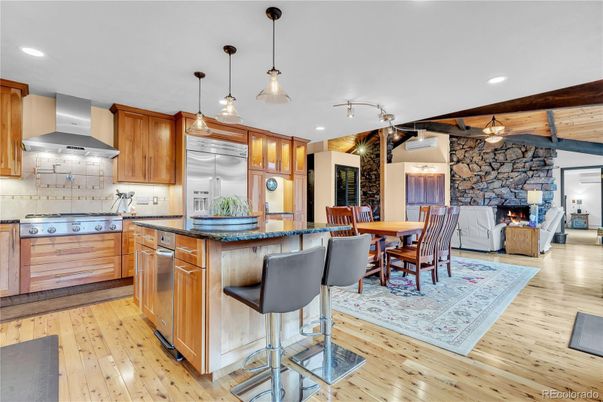 Dining room, Fireplace, Interior, Kitchen, Living room, Pendant Lights, Recessed Lighting, Stainless Steel Appliances, Stone Walls, Wooden Beams, Wood Texture Flooring