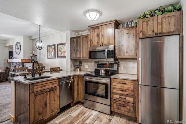 Dining room, Interior, Kitchen, Pendant Lights, Stainless Steel Appliances, Wood Texture Flooring