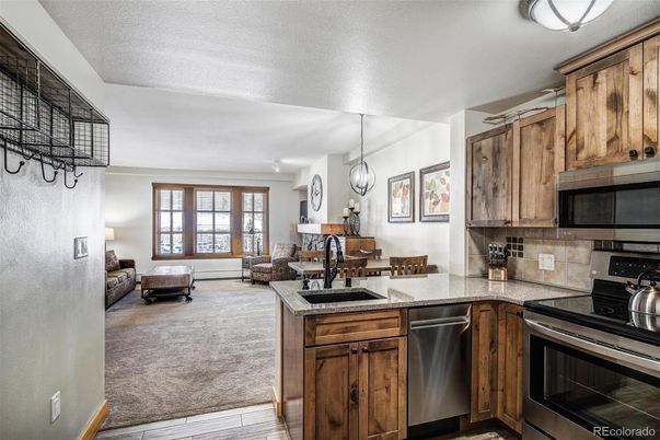 Dining room, Interior, Kitchen, Living room, Pendant Lights, Stainless Steel Appliances, Wood Texture Flooring