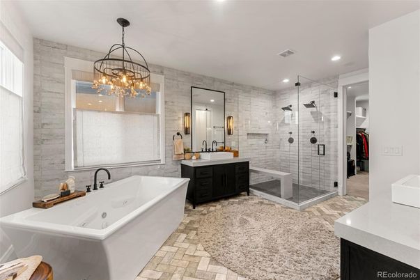 Bathroom, Dual Sink Vanities, Free Standing Baths, Glass Shower, Interior, Pendant Lights, Recessed Lighting, Stone Walls