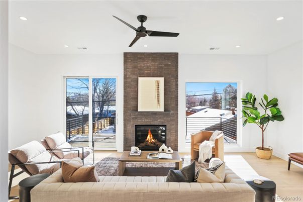 Fireplace, Interior, Living room, Recessed Lighting, Stone Walls, Wood Texture Flooring