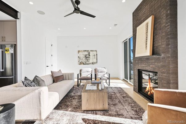 Fireplace, Interior, Living room, Recessed Lighting, Stone Walls, Wood Texture Flooring