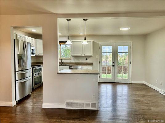 Interior, Kitchen, Pendant Lights, Recessed Lighting, Stainless Steel Appliances, Wood Texture Flooring