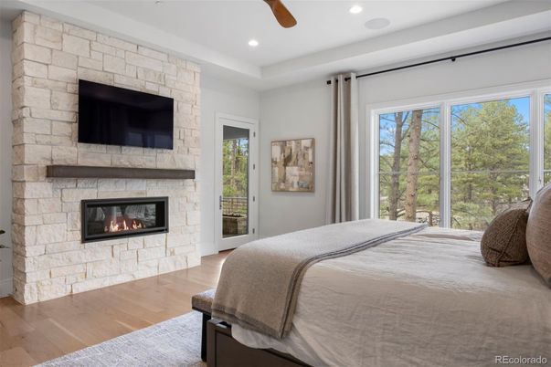Bedroom, Fireplace, Interior, Recessed Lighting, Stone Walls, Wood Texture Flooring