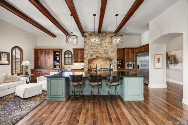 Interior, Kitchen, Pendant Lights, Recessed Lighting, Stainless Steel Appliances, Stone Walls, Wooden Beams, Wood Texture Flooring