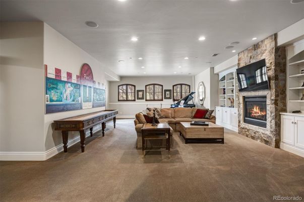 Billiard Table, Fireplace, Fitness Equipment, Game Room, Interior, Living room, Recessed Lighting, Stone Walls