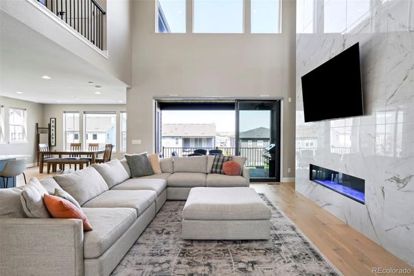 Dining room, Fireplace, Interior, Living room, Marble Walls, Recessed Lighting, Wood Texture Flooring