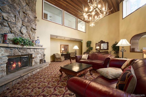 Chandelier, Fireplace, Interior, Living room, Stone Walls