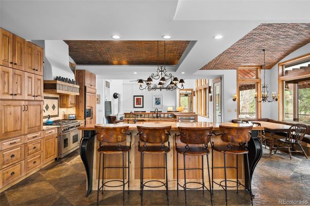 Chandelier, Dining room, Interior, Kitchen, Pendant Lights, Recessed Lighting, Stainless Steel Appliances, Wooden Ceilings