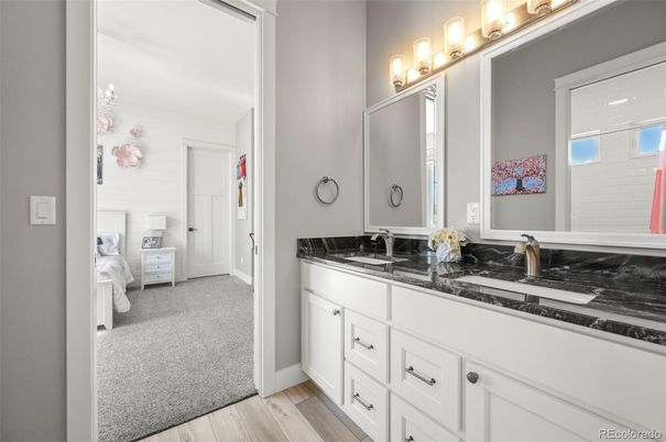 Bathroom, Bedroom, Chandelier, Dual Sink Vanities, Interior, Wood Texture Flooring