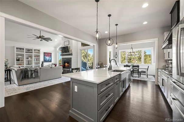 Dining room, Fireplace, Interior, Kitchen, Living room, Pendant Lights, Recessed Lighting, Stainless Steel Appliances, Wood Texture Flooring