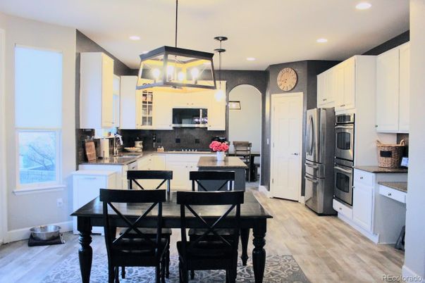 Dining room, Interior, Kitchen, Pendant Lights, Recessed Lighting, Stainless Steel Appliances, Wood Texture Flooring