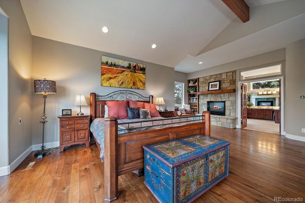 Bedroom, Fireplace, Interior, Recessed Lighting, Stone Walls, Wooden Beams, Wood Texture Flooring