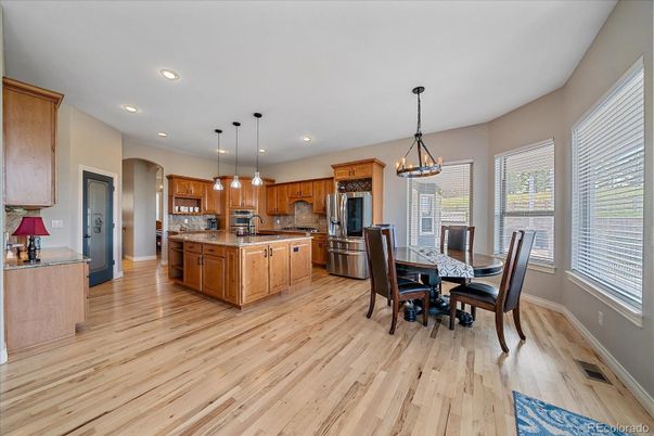 Dining room, Interior, Kitchen, Pendant Lights, Recessed Lighting, Stainless Steel Appliances, Wood Texture Flooring