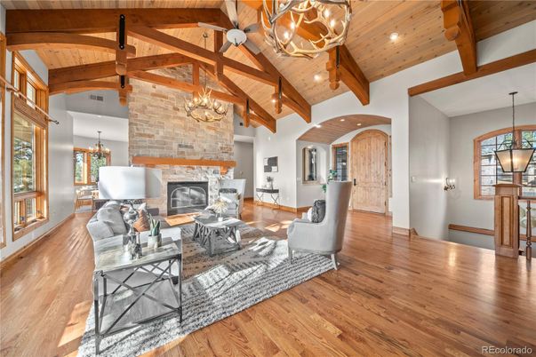 Chandelier, Fireplace, Interior, Living room, Pendant Lights, Recessed Lighting, Stone Walls, Wooden Beams, Wooden Ceilings, Wood Texture Flooring