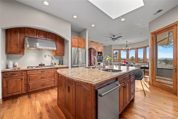 Chandelier, Dining room, Interior, Kitchen, Recessed Lighting, Stainless Steel Appliances, Wood Texture Flooring