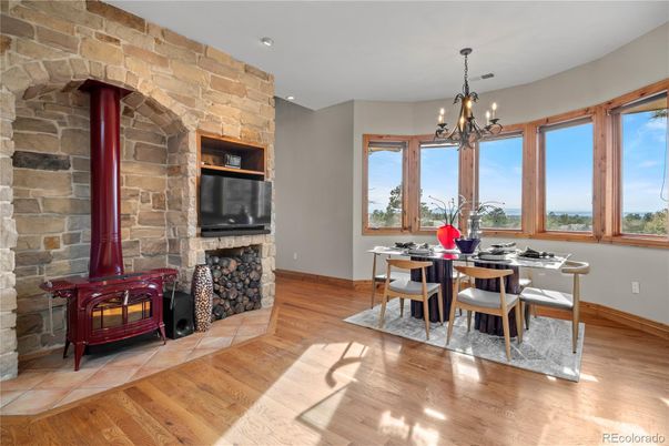 Chandelier, Dining room, Fireplace, Interior, Recessed Lighting, Stone Walls, Wood Texture Flooring