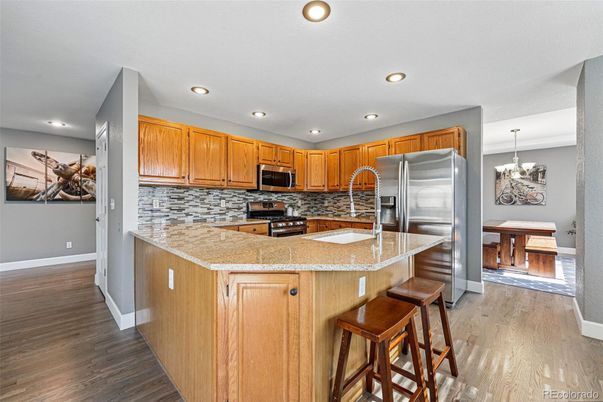 Chandelier, Dining room, Interior, Kitchen, Recessed Lighting, Stainless Steel Appliances, Wood Texture Flooring