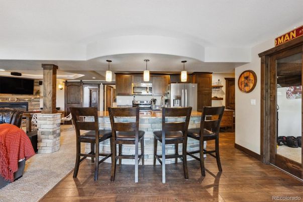 Dining room, Interior, Kitchen, Pendant Lights, Stainless Steel Appliances, Wood Texture Flooring